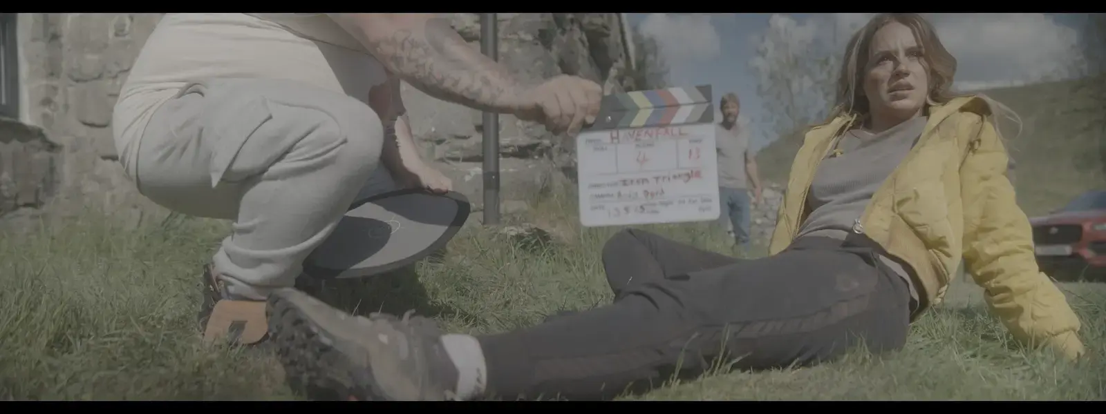 Exterior clapperboard setup in the Welsh landscape